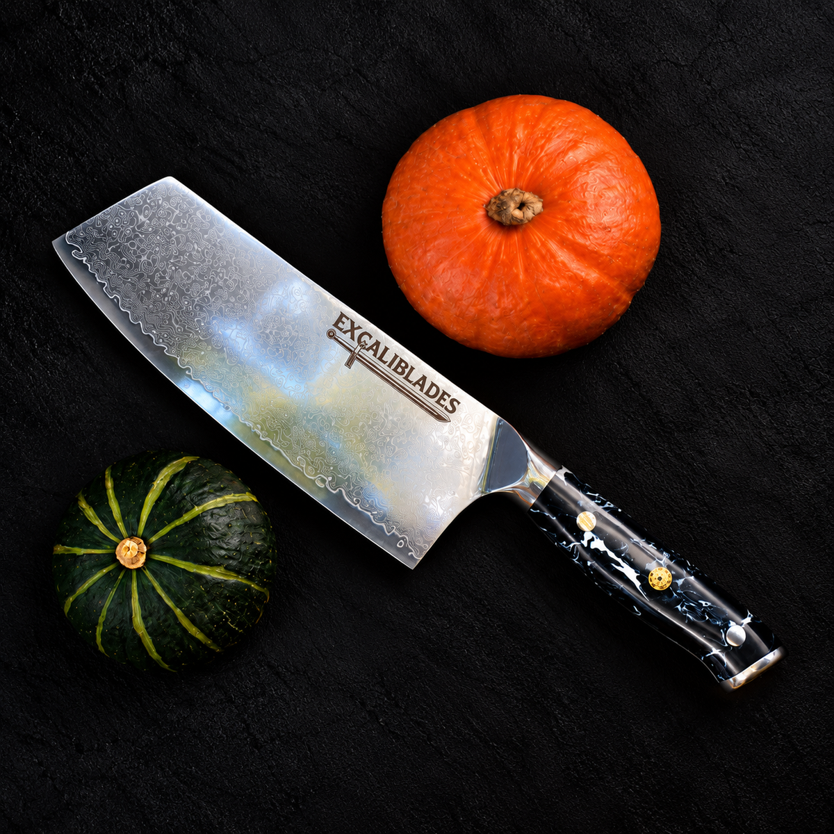 Excaliblades cleaver knife beside orange and green pumpkins